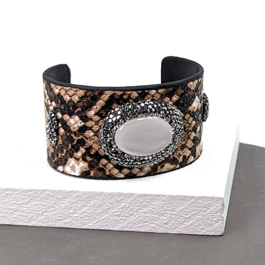 Classy snake effect PU open cuff with crystal studded mother of pearl oval feature
